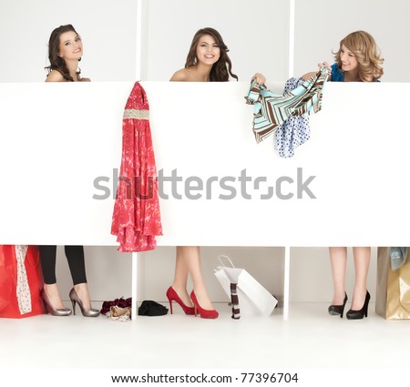 young women trying clothes shop wordrobe