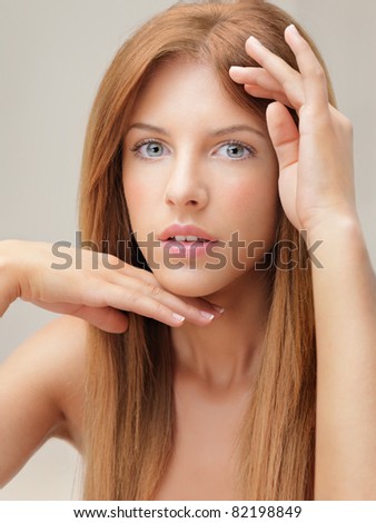 beautiful young blonde woman hands framing face