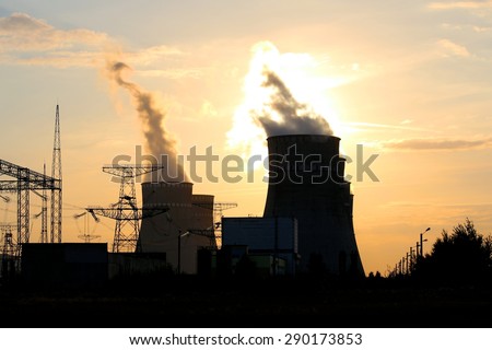 Cooling towers against the sun and Electricity towers