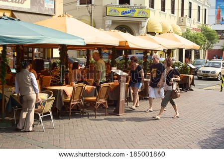 LIMA, PERU - DECEMBER 13, 2011: Unidentified people at the restaurants El Parquetito and El Tigre in the street Calle Lima at the Kennedy Park in Miraflores on December 13, 2011 in Lima, Peru.