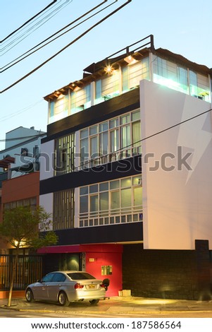 LIMA, PERU - MARCH 29, 2012: Modern building in the evening on the corner of the streets Calle Ocharan and Calle Manco Capac in the district of Miraflores on March 29, 2012 in Lima, Peru.