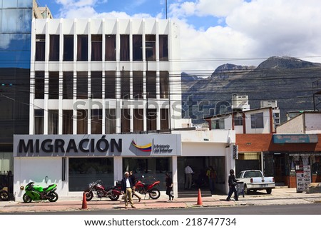 QUITO, ECUADOR - AUGUST 4, 2014: Unidentified people in front of the Migracion (Migration office) building on Amazonas Avenue on August 4, 2014 in Quito, Ecuador