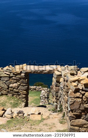 View through door frame of Chinkana archeological site of Tiwanaku origin on Isla del Sol (Island of the Sun) on Lake Titicaca in Bolivia (Selective Focus, Focus on the door frame and beyond)