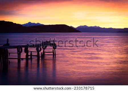 Sunrise over Lake Titicaca in the bay of Cha\'lla with the snow-capped mountains of the Andes in the back viewed from the small village of Cha\'llapampa on Isla del Sol (Island of the Sun) in Bolivia