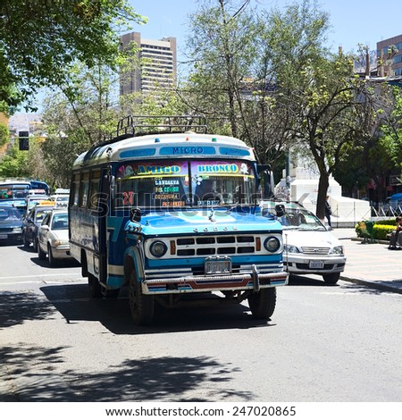 LA PAZ, BOLIVIA - OCTOBER 15, 2014: An old blue Dodge D400 bus used for public transportation driving on El Prado avenue in the city center on October 15, 2014 in La Paz, Bolivia