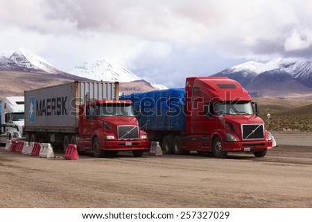 PASO CHUNGARA-TAMBO QUEMADO, CHILE-BOLIVIA - JANUARY 21, 2015: Trucks standing at border crossing between Chile and Bolivia at Chungara and Tambo Quemado between La Paz and Arica on January 21, 2015