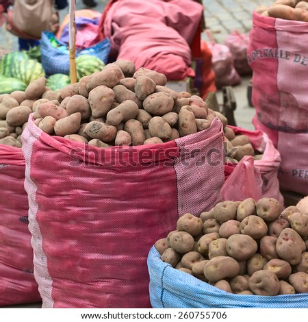 LA PAZ, BOLIVIA - NOVEMBER 10, 2014: Sacks of potatoes being sold on the roadside along Zoilo Flores street in the city center on November 10, 2014 in La Paz, Bolivia