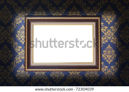 blank photo frame on old wallpaper