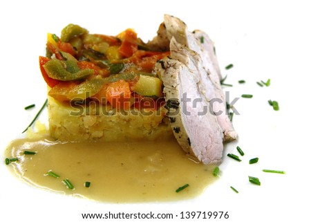 Traditional vegetable ratatouille and pig meat