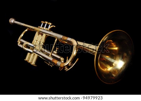 gold trumpet isolated on the black background