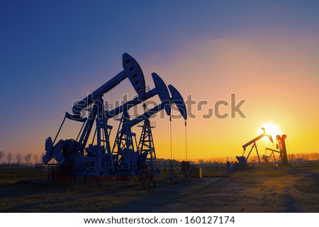 Oil Pump Oil Rig In The Sunset Background For Design