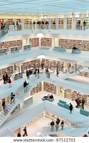 STUTTGART, GERMANY - OCTOBER 23: Book lovers visit the the new municipal public library on Oct. 23, 2011 in Stuttgart, Germany. It is designed by Eun, Young, Yi and provides more than 500.000 books. This is a view from the top level into the upper hall.