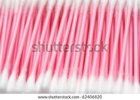 line of cotton buds with pink plastic basis