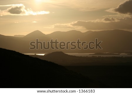 The Sun approaches the Luss Hills at it moves towards setting over Loch Lomond