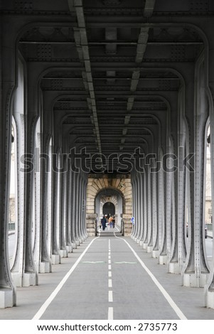 Diminishing perspective below a Parisian railway bridge