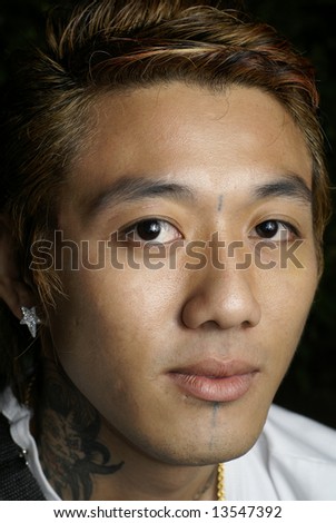 stock photo Asian man with tattoo