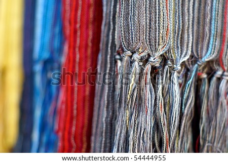 Colorful cashmere shawls hanging background