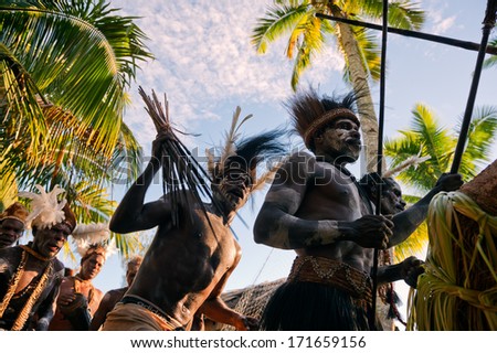 JOW VILLAGE ASMAT NEW GUINEA INDONESIA JUNE 28 The Village follows the ancestors embodied in spirit mask as they tour the village the Doroe ceremony June28 2012 in Jow Village Asmat Indonesia JOW VILLAGE ASMAT NEW GUINEA INDONESIA JUNE 28 The Village follows the ancestors embodied in spirit mask as they tour the village the Doroe ceremony June28 2012 in Jow Village Asmat Indonesia