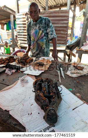 BRAZZAVILLE, REPUBLIC OF CONGO, AFRICA - SEPTEMBER 26, 2013: Smoked monkey  sold a local market. 26 september, 2013, Brazzaville, Republic of Congo, Africa.
