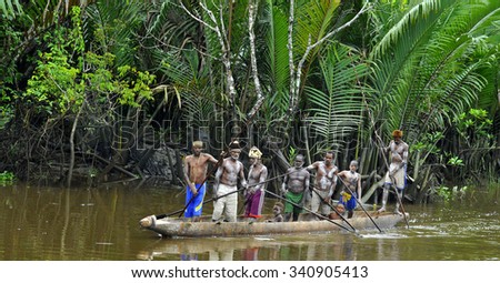 INDONESIA, IRIAN JAYA, ASMAT PROVINCE, JOW VILLAGE - JUNY 28: Canoe war ceremony of Asmat people. Headhunters of a tribe of Asmat . New Guinea Island, Indonesia. June 28 2012