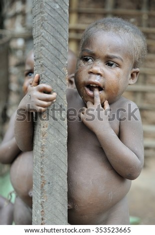 DZANGA-SANHA FOREST RESERVE, CENTRAL-AFRICAN REPUBLIC (CAR), AFRICA - NOVEMBER 5, 2008: Portrait of a child from a Baka tribe of pygmies.  Jungle of CAR. Africa. Jungle of the Central-African Republic