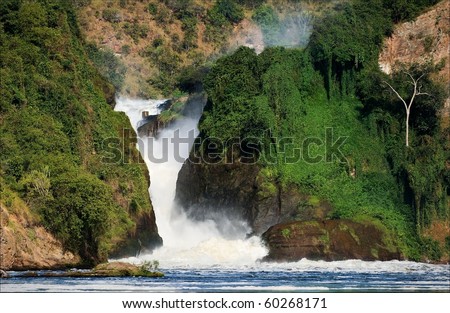 Murchison  falls. Murchison  falls roar, clamped between two rocks covered with greens.