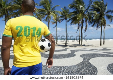 Brazilian Soccer Player Holding Football Wears 2014 Shirt In Brazil Colors Rio De Janeiro