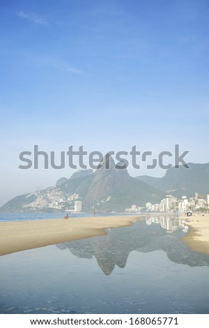 Reflection of Rio de Janeiro Ipanema Beach Brazil with Two Brothers Dois Irmaos Mountain city skyline