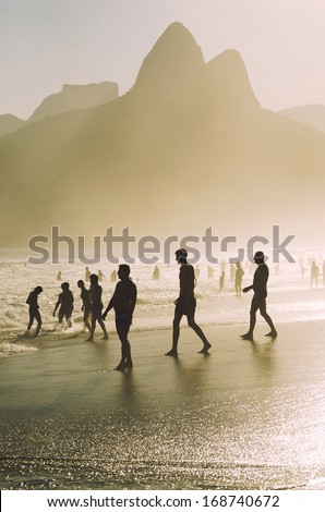 Sunset Beach Silhouettes Ipanema Rio De Janeiro Brazil In Front Of Two Brothers Dois Irmaos Mountain