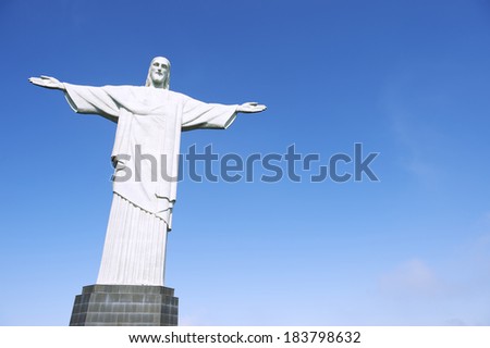 RIO DE JANEIRO, BRAZIL - OCTOBER 20, 2013: Statue of Christ the Redeemer stands on its base against clear blue sky.