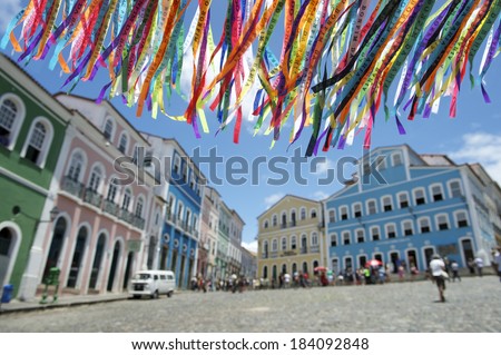 Decorative Brazilian wish ribbons waving in the sky above colonial architecture of Pelourinho Salvador Bahia Brazil