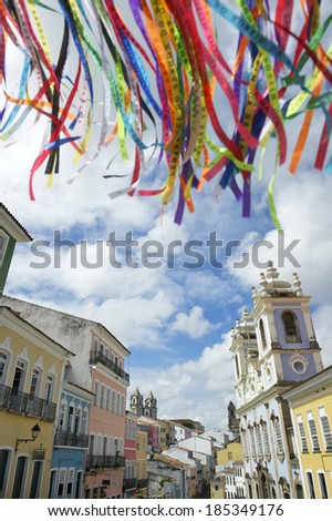 Colorful Brazilian wish ribbons waving in the bright sky above colonial architecture of Pelourinho Salvador Bahia Brazil