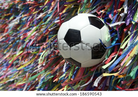 Football soccer ball at wall of Brazilian wish ribbons at the Bonfim church in Salvador Bahia Brazil