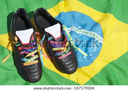Good luck soccer football boots soccer cleats laced with Brazilian wish ribbons on Brazilian flag