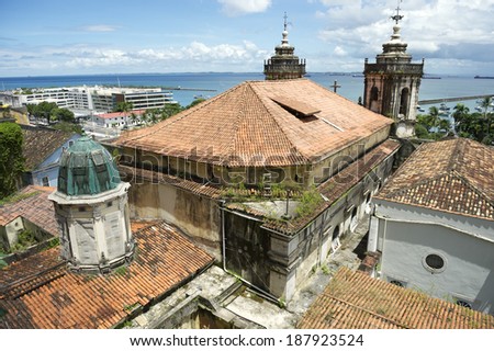 Salvador Bahia Brazil skyline with colonial church architecture terra cotta tiles and Bay of All Saints