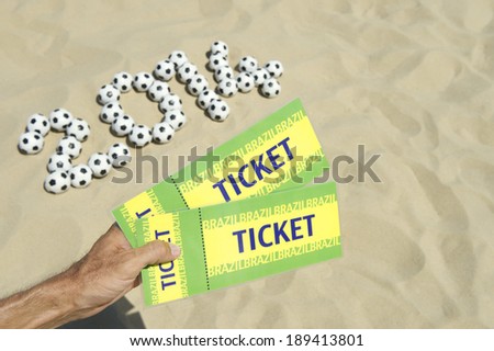 Two tickets to 2014 football event on Brazilian beach with soccer balls