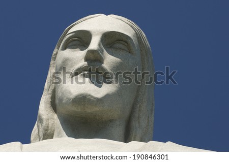 RIO DE JANEIRO, BRAZIL - OCTOBER 20, 2013: Close-up of the face of the statue of Christ the Redeemer at Corcovado Mountain against blue sky.