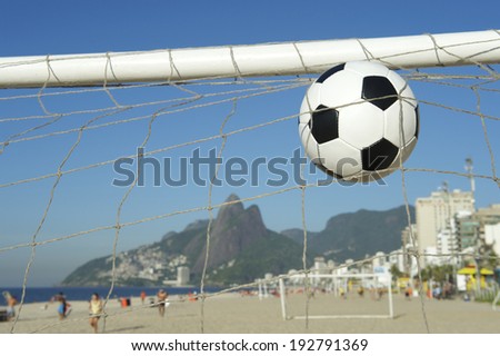 Soccer goal ball scoring in football net on the beach in Rio de Janeiro Brazil