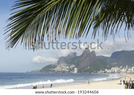 Ipanema Beach Rio de Janeiro Brazil view with palm frond above Two Brothers Mountain