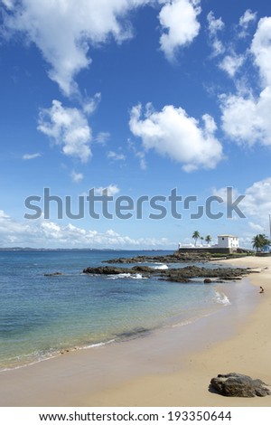 Scenic tropical view of the Praia Porto da Barra city beach with view of the Forte Santa Maria in Salvador Bahia Brazil
