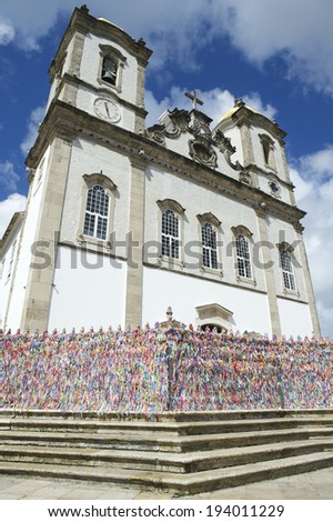 Steps leading up to colorful wall of wish ribbons at the entrance to the Igreja Nosso Senhor do Bonfim da Bahia church in Salvador Bahia Brazil