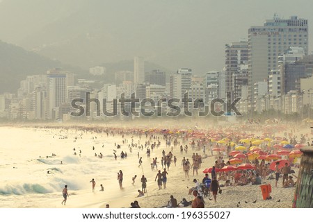 RIO DE JANEIRO, BRAZIL - CIRCA JANUARY, 2011: People crowd the beach near the Posto 9 section of Ipanema.