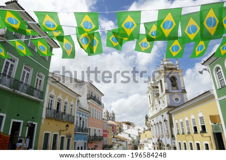 Brazilian flag bunting fluttering over historic city center colonial architecture of Pelourinho Salvador da Bahia Brazil