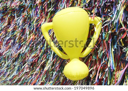 Good luck championship trophy at wall of Brazilian wish ribbons at the Bonfim church in Salvador Bahia Brazil