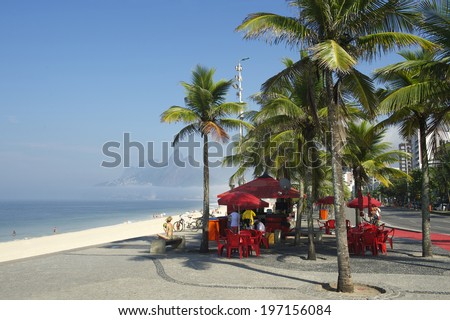 Rio de Janeiro beach kiosk at Arpoador with Two Brothers Mountain skyline in the background