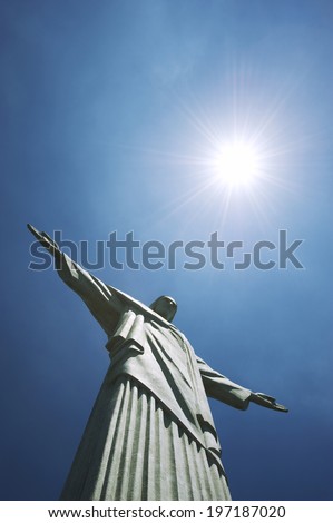 RIO DE JANEIRO, BRAZIL - OCTOBER 20, 2013: Close-up of the statue of Christ the Redeemer at Corcovado Mountain standing under the sun against blue sky.