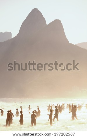 Two Brothers Dois Irmaos Mountain sunset silhouettes on Ipanema Beach Rio de Janeiro Brazil