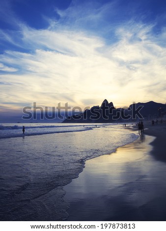 Dusk sunset reflection of Rio de Janeiro Ipanema Beach Brazil with Two Brothers Mountain