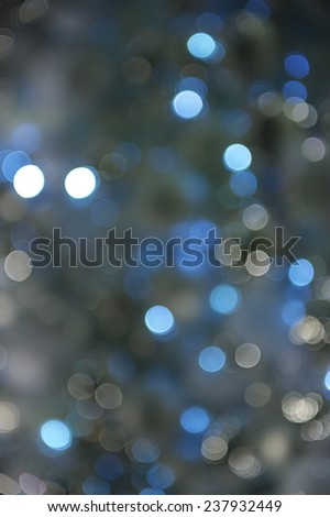 Wintry blue holiday Christmas lights background in bokeh bubbles