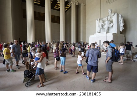 WASHINGTON DC, USA - JULY 30, 2014: Crowds of tourists take photos at the statue of Abraham Lincoln at the Lincoln Memorial.